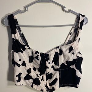Brand new, cow print crop top with rib detailing, and front clasps, size large
